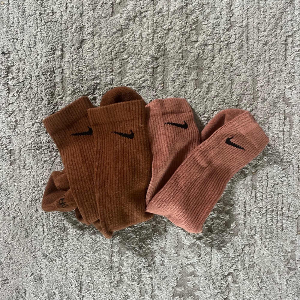 Brown and pink Nike socks